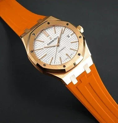 Montre de luxe avec boîtier doré et bracelet orange, accessoire élégant misterchrono.com